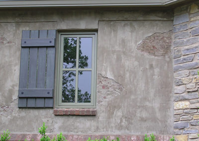 exterior of home window with shutter by Greg Avery Homes in Stillwater, OK 74074