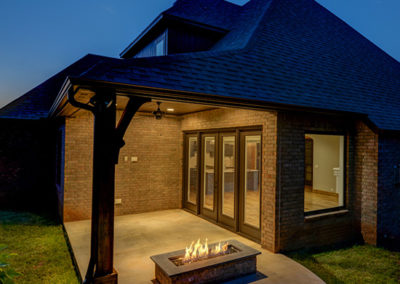 exterior of home with fireplace by Greg Avery Homes in Stillwater, OK 74074